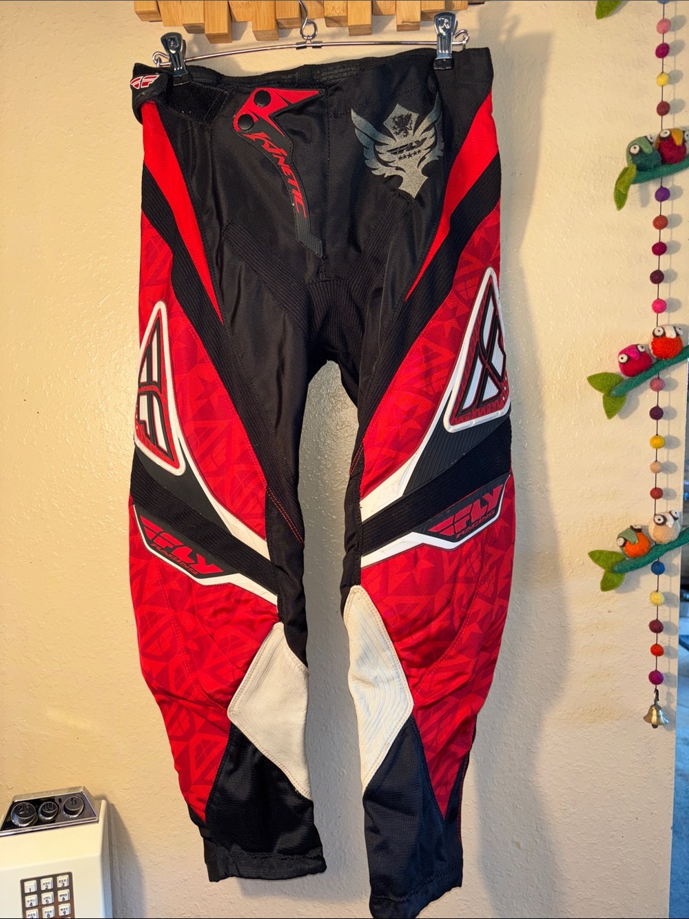Fly Racing Kinetic motocross pants in a red and black colorway. Fly Racing